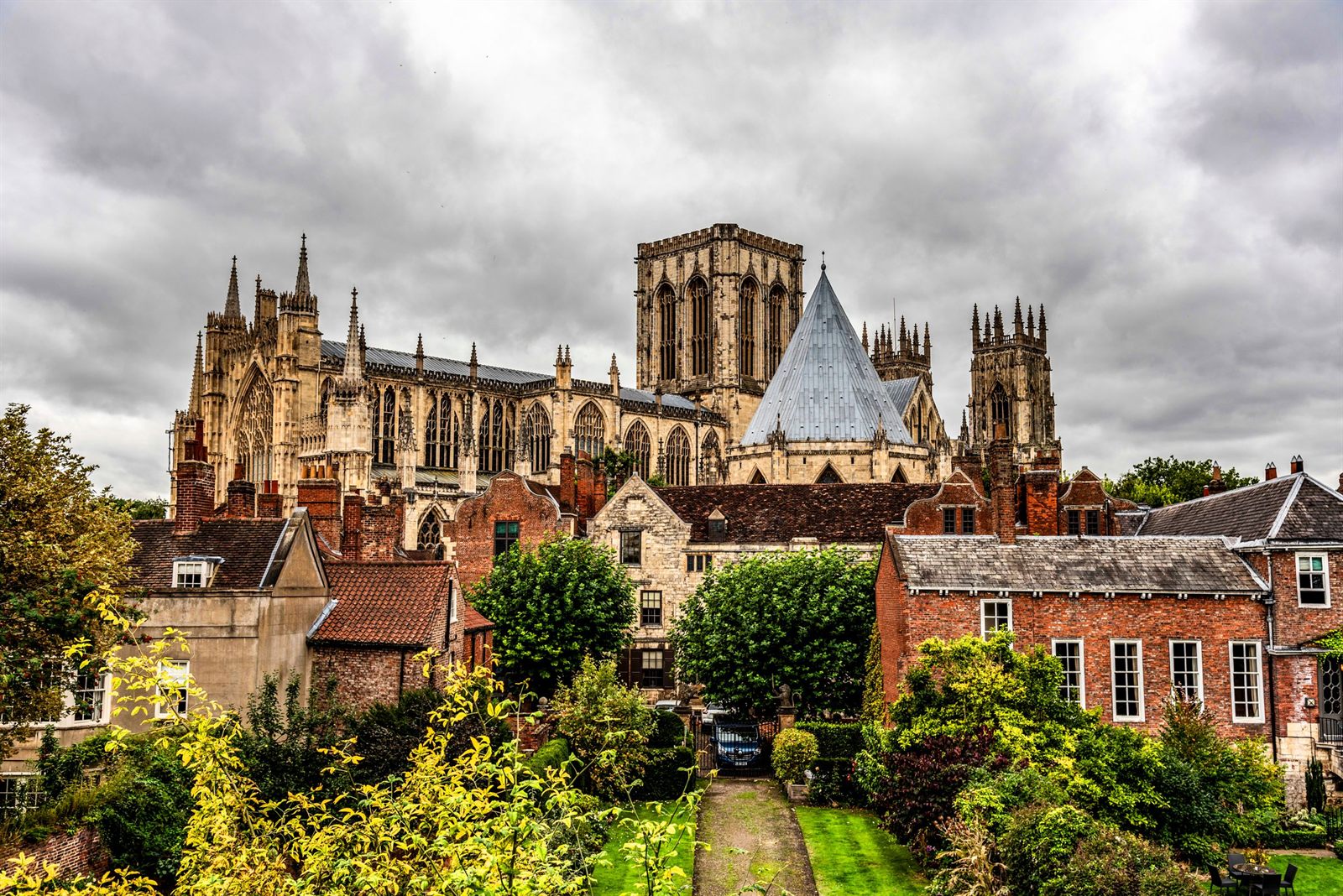 York Minster rising above old brick houses and gardens